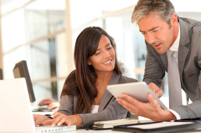 Two People Looking At Book Small File